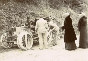 History of the Automobile, The travelling party observes the changing of the car's tyres