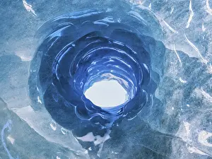 Hole in an ice cave, formed by melting and subglacial streams