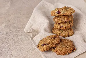 Homemade oatmeal cookies with berries on a linen napkin