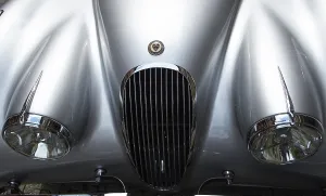Hood with grill and headlights of a Jaguar Coventry oldtimer
