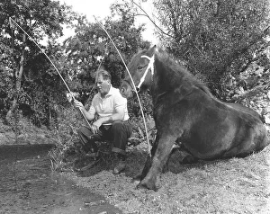 Horse and man fishing, England, Great Britain