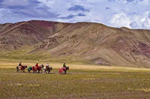 Horserider carawan in mountainous landscape along the road from Ali to Gerze
