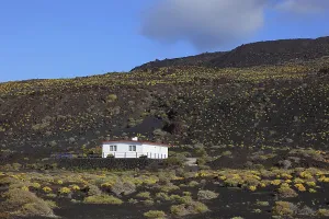 House in the blue volcanic landscape at Punta de Fuencaliente