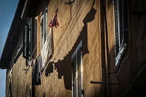 House facade with washing line in the afternoon sun