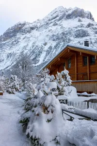 House and Mountain Peak Eiger in a Snowy Winter Christmas Day in Grindelwald