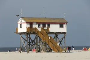 House on stilts on the beach, North Sea resort St