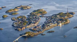 Houses on small rocky islands in the sea