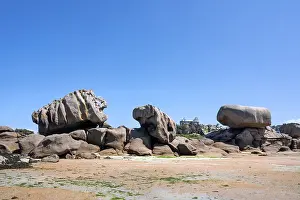 A huge granite rock formed by erosion in pink to grey-brown tones