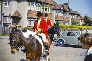Two hunters on horseback, carnival procession, Orpington, Bromley, Greater London formerly Kent, England, UK 1950 1955