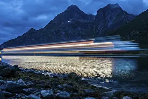 Hurtigruten cruise ship passes the Raftsund at night