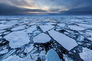 Ice field in the sea, threatening cloud atmosphere