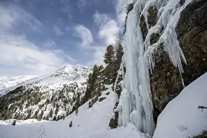 Ice waterfall, icy waterfall on a rock