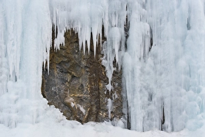 Icicles in front of a rock face