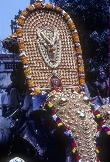 Icon of lord Krishna deity atop Caparisoned elephant in Pooram festival