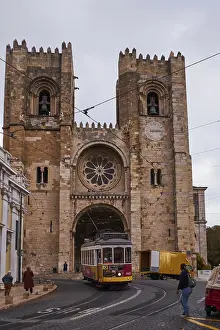 The Iconic and Famous Vintage Tram Number 28 in front of the Se Santa Maria Cathedral - Lisbon