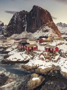Iconic red stilt houses on the coast in the village Hamnoy on the Lofoten islands in Norway on clear winter