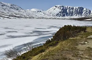Icy lake in the mountains of Norway
