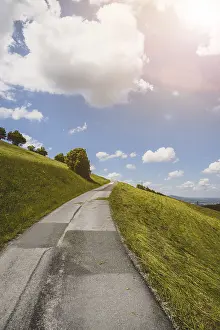 Idyllic mountain landscape, steep asphalted mountain road