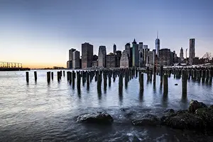 ier at Brooklyn Bridge Park with view of the East River and the skyline of Manhattan