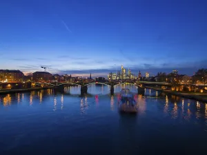 Ignatz-Bubis-Bruecke bridge, behind the skyline of Frankfurt