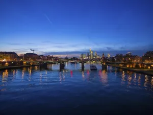 Ignatz-Bubis-Bruecke bridge, behind the skyline of Frankfurt
