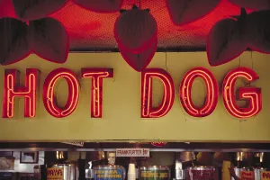 Illuminated advertising at a hot dog stand