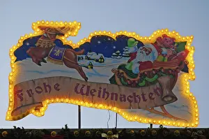 Illuminated ad with Santa Claus