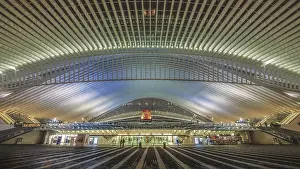 Illuminated modern station with symmetrical lines and multi-coloured lights