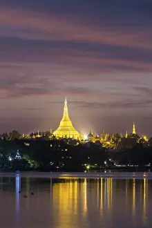 Illuminated Shwedagon Pagoda at sunset
