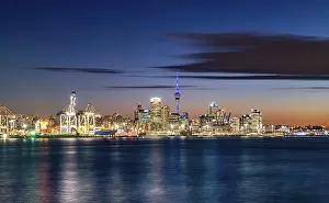 Illuminated skyline of Auckland at sunset