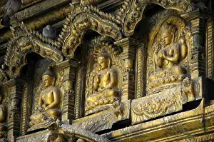 Three images of Buddha in gold Golden Temple Patan Kathmandu Nepal