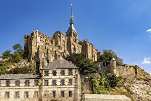Imposing castle and fortress rising against a blue sky