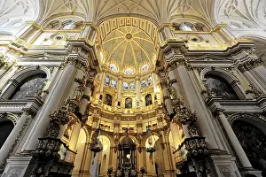 Imposing cathedral interior with elaborately decorated altar and impressive architecture