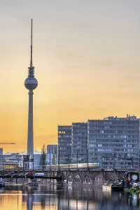 The imposing TV Tower and the Spree in Berlin after sunset
