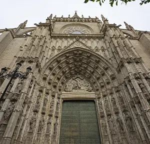 Impressive Gothic facade with detailed portal and richly decorated sculptures