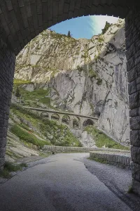 Impressive mountain range viewed through a tunnel