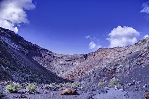 Framed Print : Impressive volcano crater with low vegetation under a blue sky