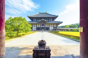 Incense burner and pillars in foreground leading to front facade of the Great Buddha Hall Daibutsuden at Todai-ji