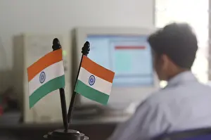 Indian National Flag, Tiranga, Man working on computer on the background