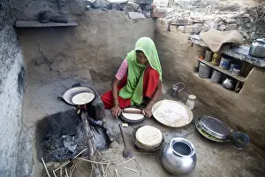 Indian rural woman making chapaati bread