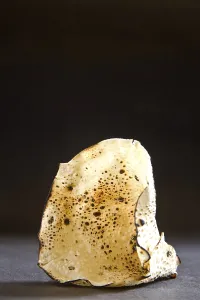 Indian snack roasted papad in cone shape on black background 16-April-2010