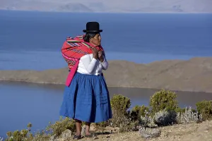 Indio woman in traditional festive costume for the New Year Festival of the Aymara Indians