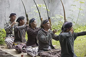 Indonesian men practicing Jemparingan