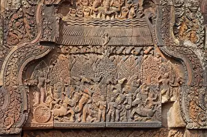 Indra, god of the sky, releasing rain in an attempt to extinguish the fire created by Agni