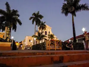 Ingelsia de la Santisima Trinidad with lantern in the centre of Trinidad with palm trees