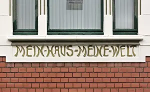 Inscription on the facade: MY HOUSE MY WORLD<br> Inscription on the faade: MY HOUSE MY WORLD