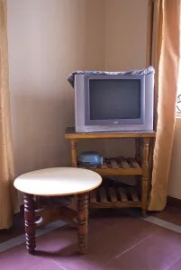 Interior of hotel with television and table