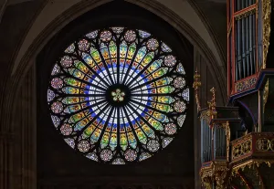 Interior view, large rose window on the west facade and nave organ by Andreas Silbermann