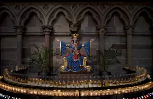 Interior view, statue of the Virgin Mary in a circle of sacrificial candles