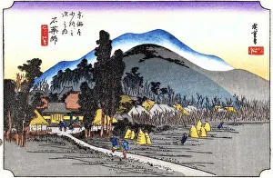 Ishiyakushi: A temple in a grove of trees on the left and the village on the right